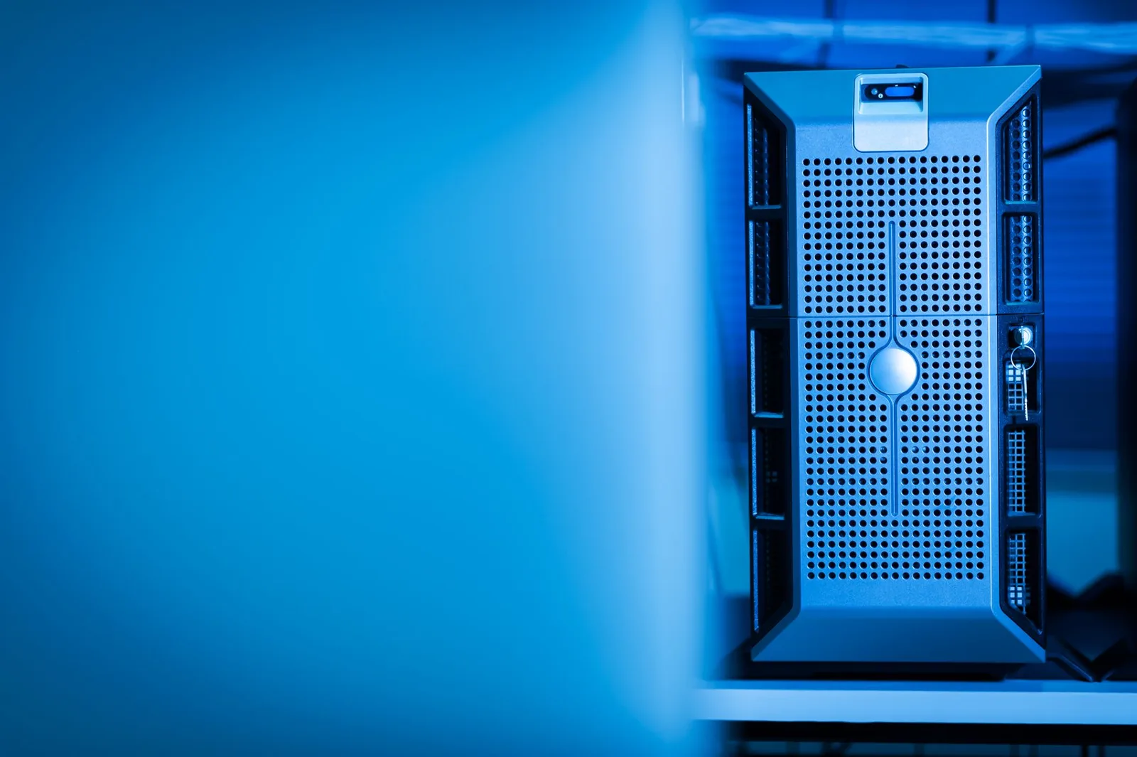 Blue-lit server unit in a data center, the infrastructure where AI agents now operate
