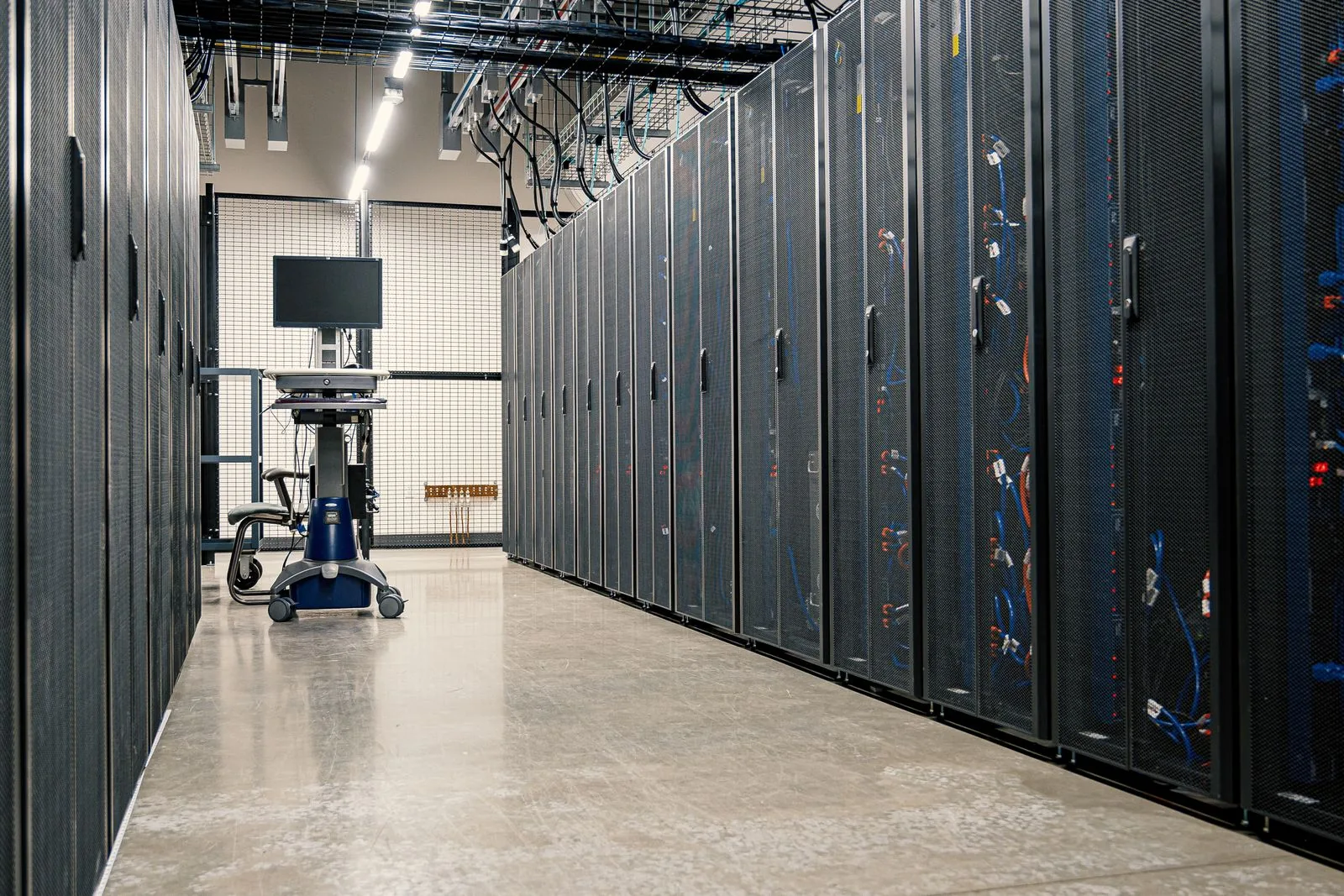 Modern data center corridor with server racks and computer equipment