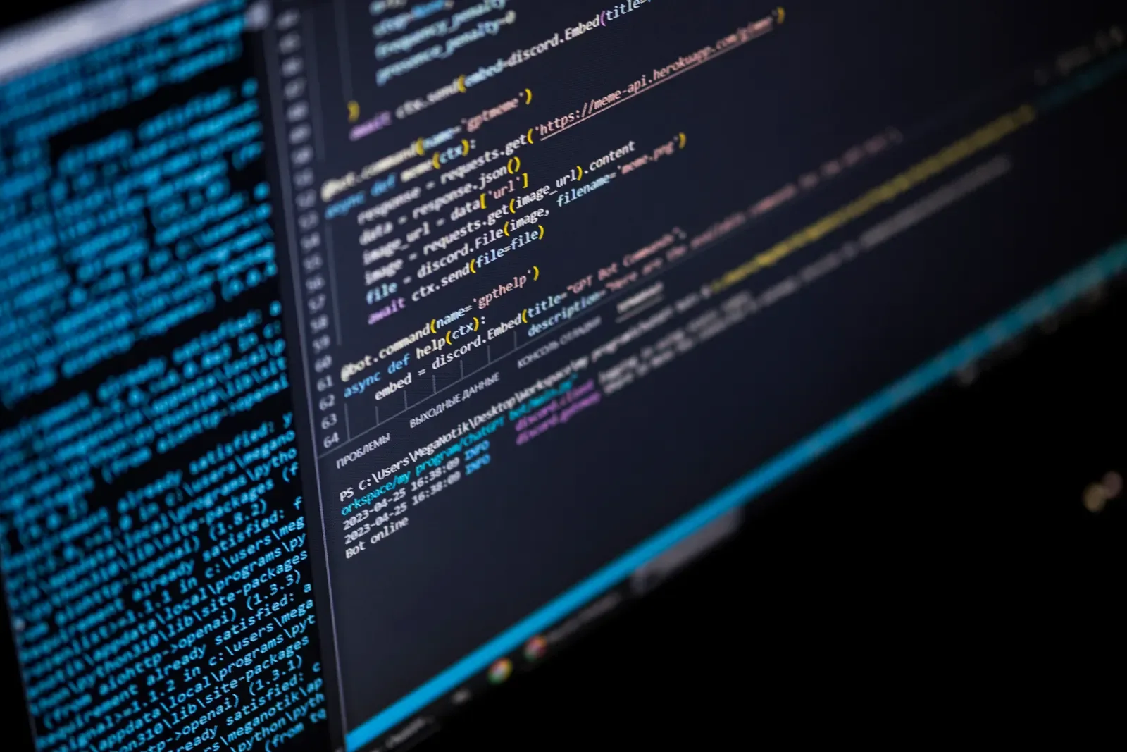 Close-up of a computer screen displaying colourful programming code in a development environment