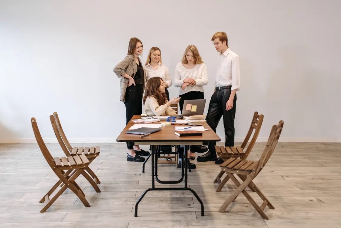 Creative team reviewing content drafts around a table