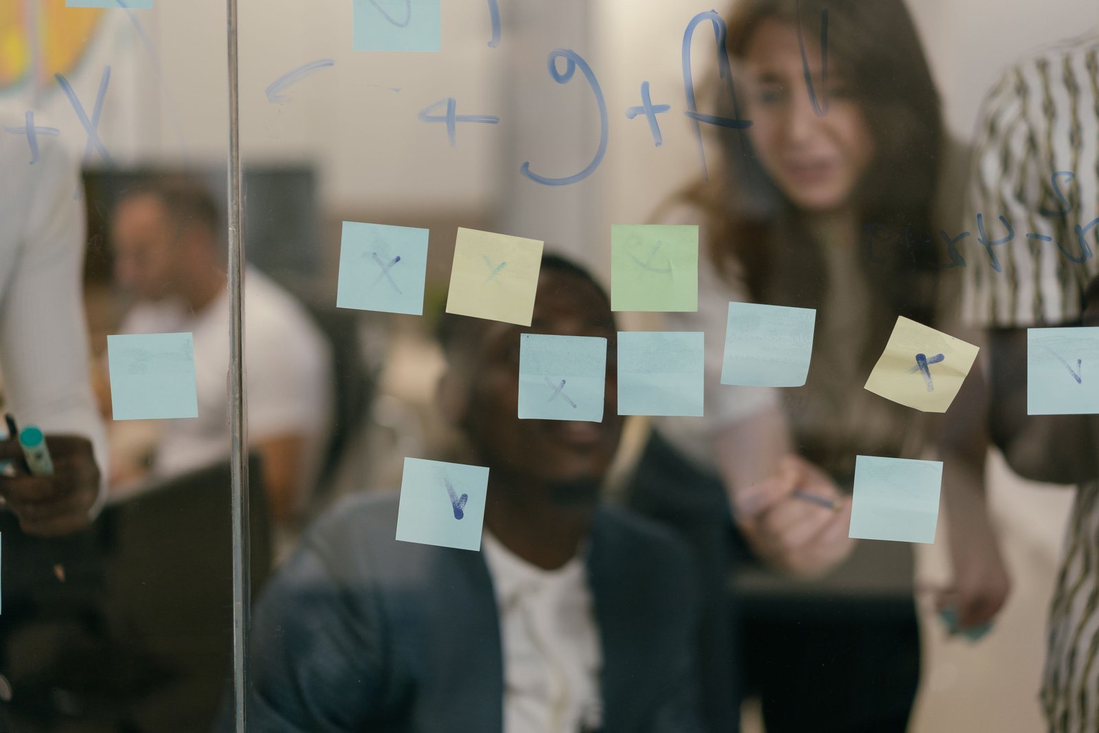Engineers mapping an automation workflow on a whiteboard